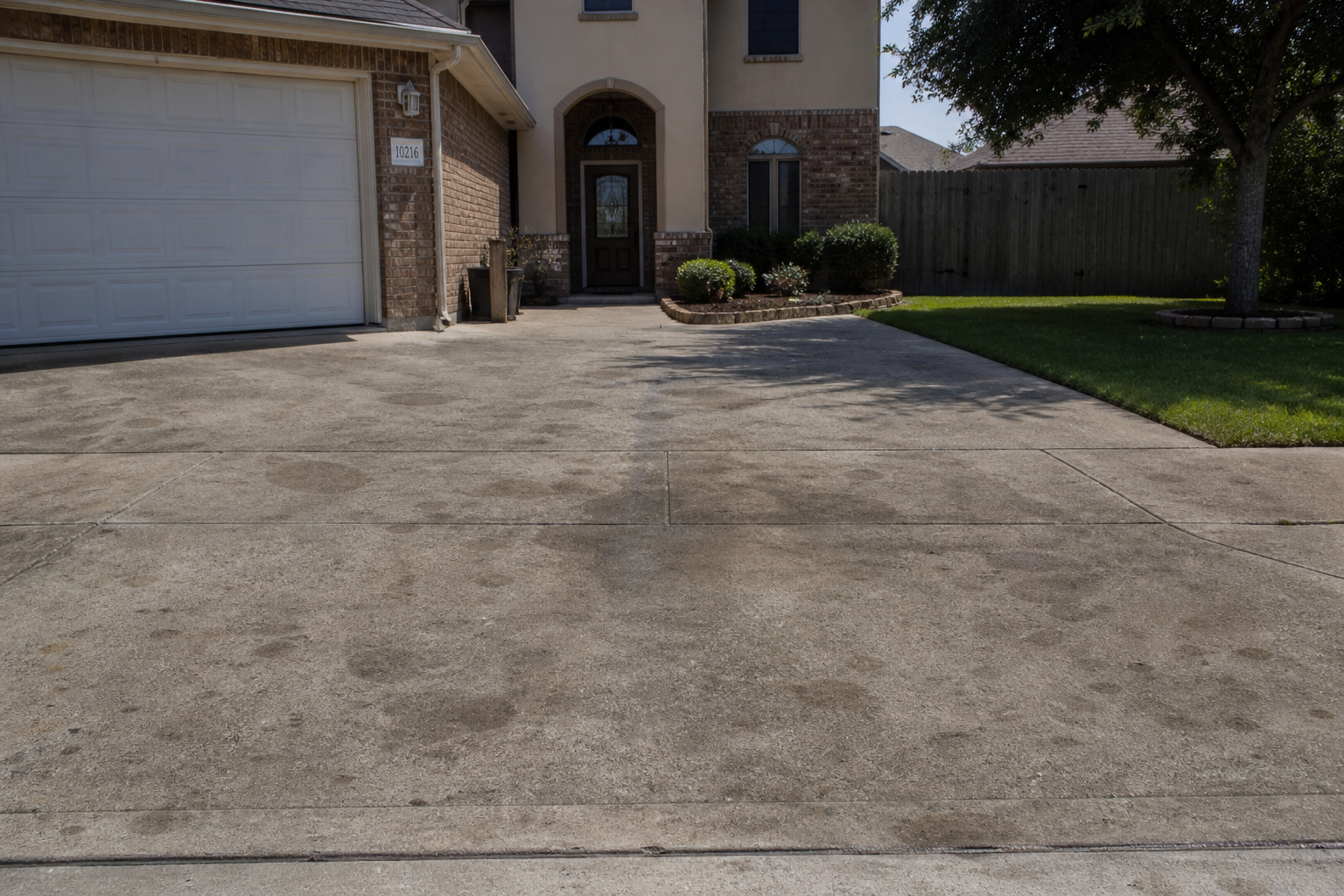 Driveway before C5 Hydroforce concrete cleaning